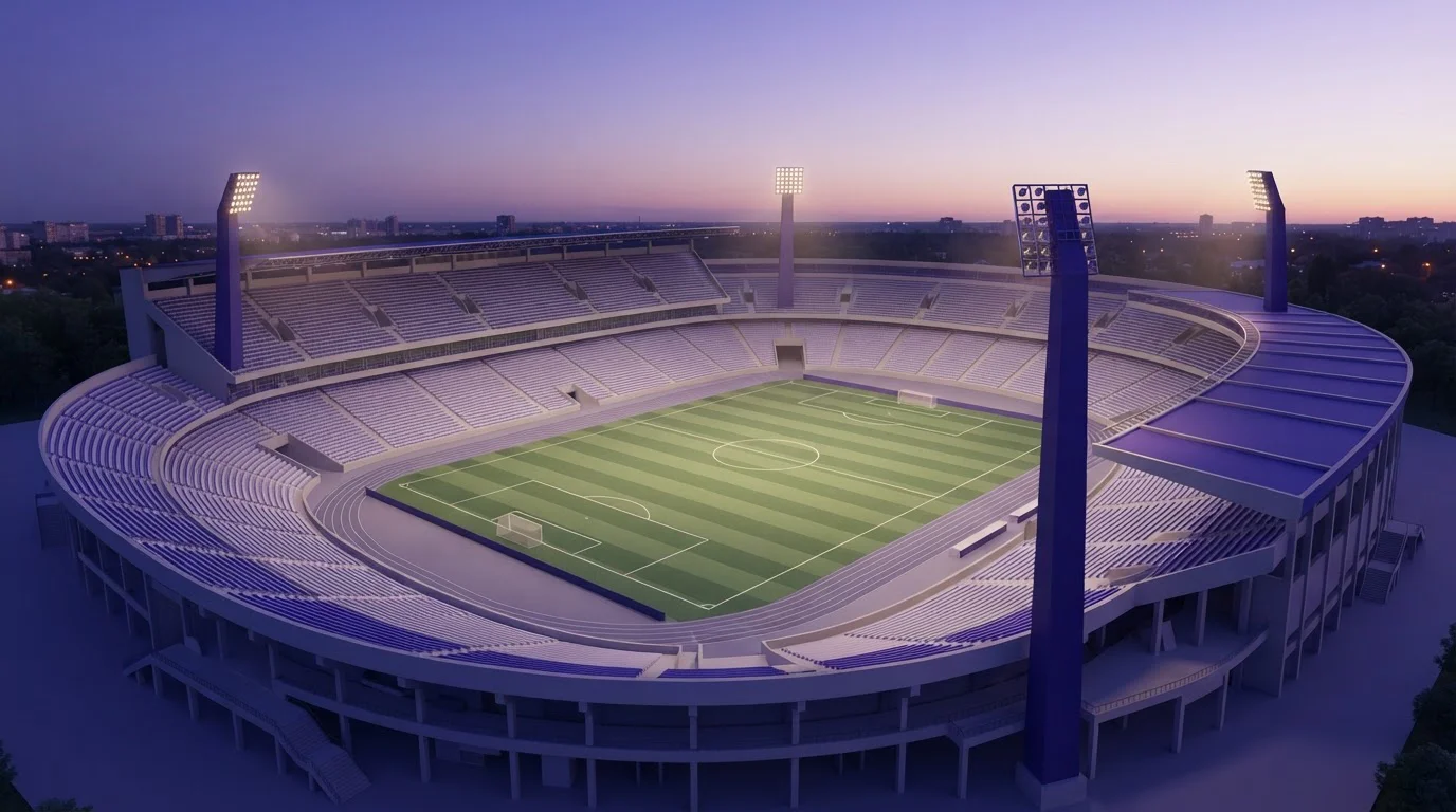 Beleuchtetes Sportstadion bei Abenddämmerung mit Spielfeld und Flutlichtmasten